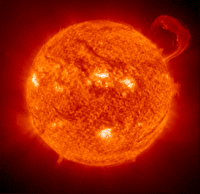 A handle-shaped cloud of plasma erupts from the Sun. (NASA)