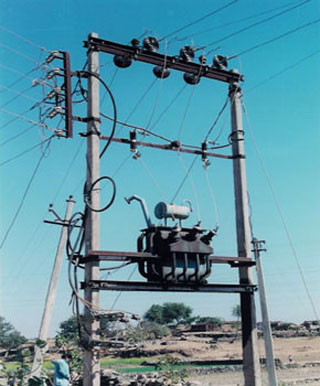 Photo of transformer and power lines in India.