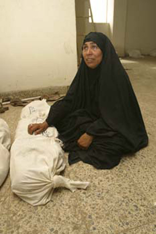 A photo of a grieving widow. A photo of a grieving widow.