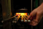 A photograph of a glass furnace in the MIT Glass Lab where artisans work for hours and make glass creations.