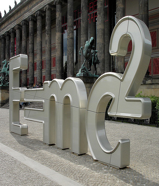 A photograph of a sculpture, which in large silver shapes forms Einstein's famous theory of relativity, "e = mc²." A photograph of a sculpture, which in large silver shapes forms Einstein's famous theory of relativity, "e = mc²."