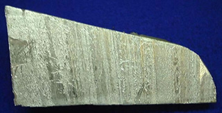 A cross-section photo of a chunk of aluminum. A cross-section photo of a chunk of aluminum.