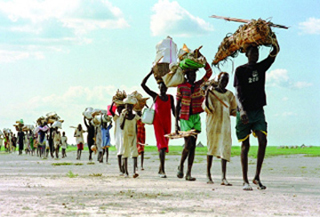 A line of Sudanese refugees fleeing from civil war.