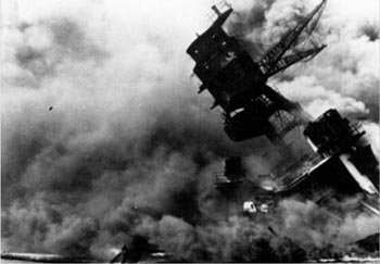 The USS Arizona burning after the Japanese attack on Pearl Harbor, December 7, 1941.